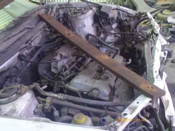 TAPABARRO Mazda 323 2002  USADO EN DESARME